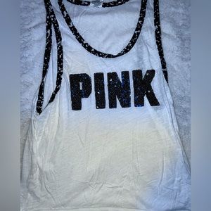 PINK muscle tank, but it’s White & Black. Gently used then thrown in the Closet✅